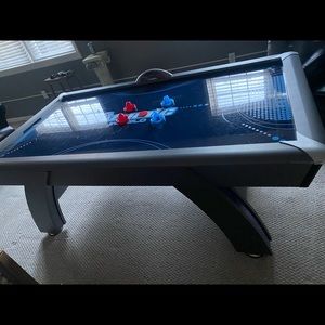 Atomic indigo LED air hockey table with pucks and pushers